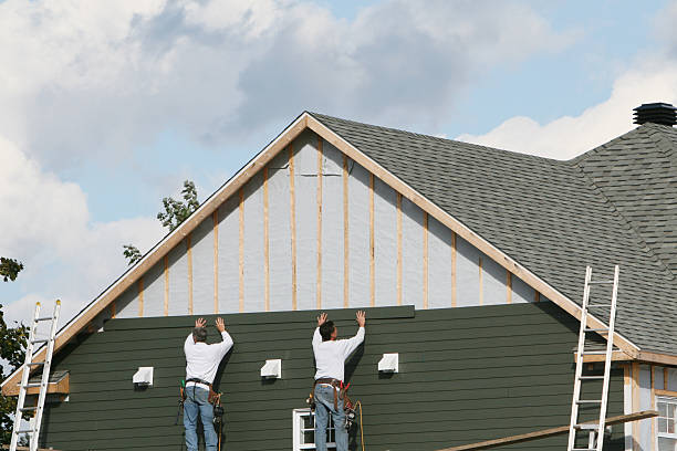 Professional Storm Damage Siding Repair technician working in East Palestine, OH